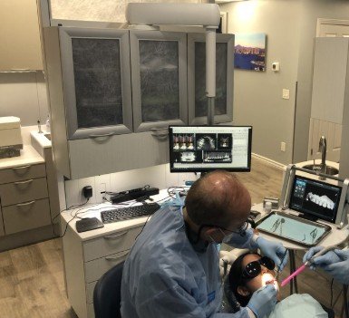 Dr. Raygada reviewing a digital scan during treatment at South Bay Dental Arts